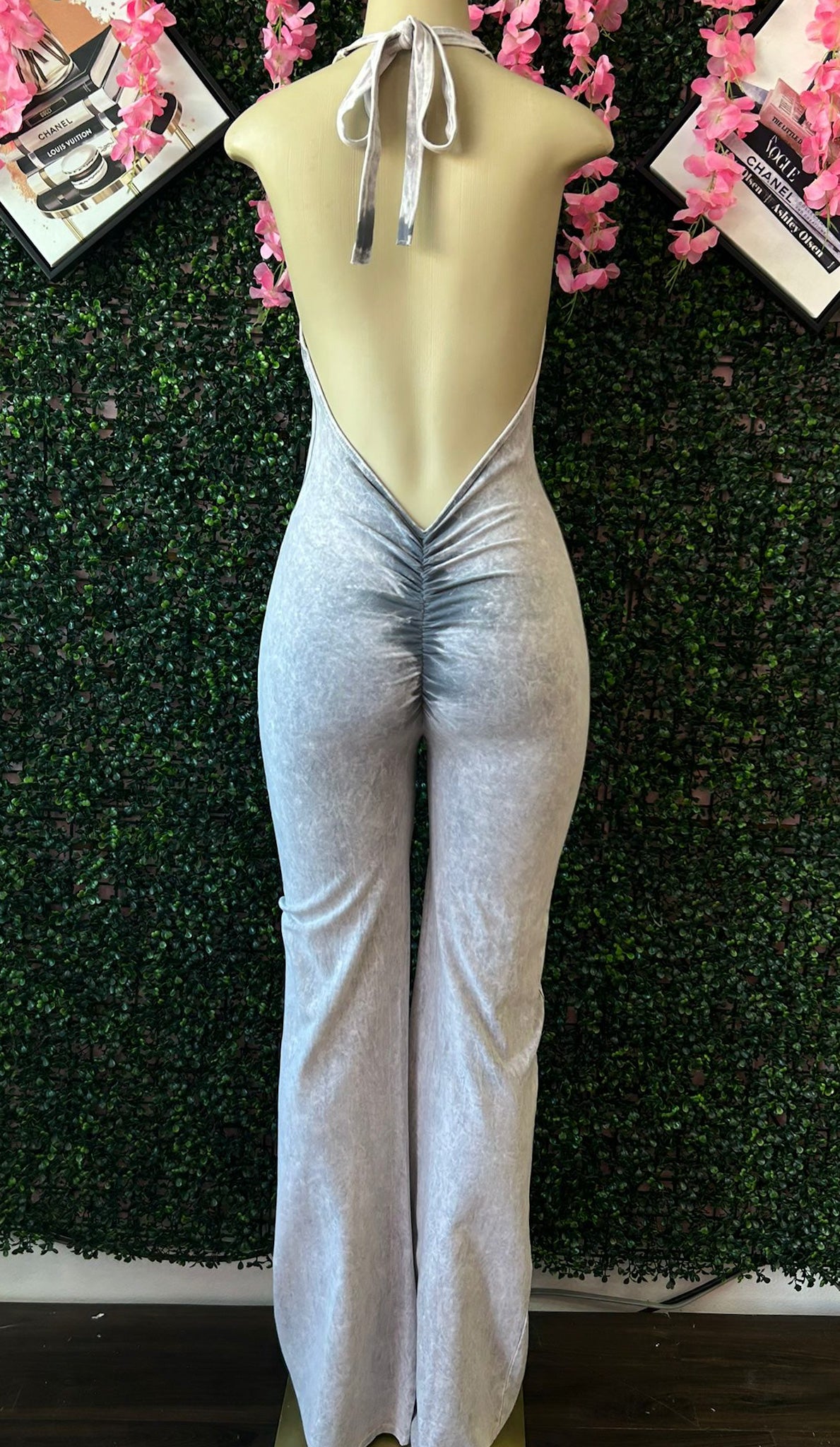 HALTER FLARE JUMPSUIT WITH OPEN BACK AND RUCHED DETAIL